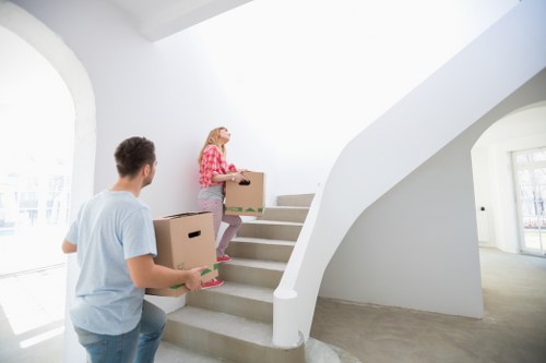Professional mover securing household items inside a van