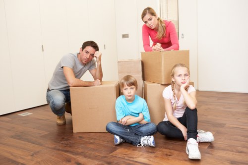 Commercial movers handling office items and furniture carefully